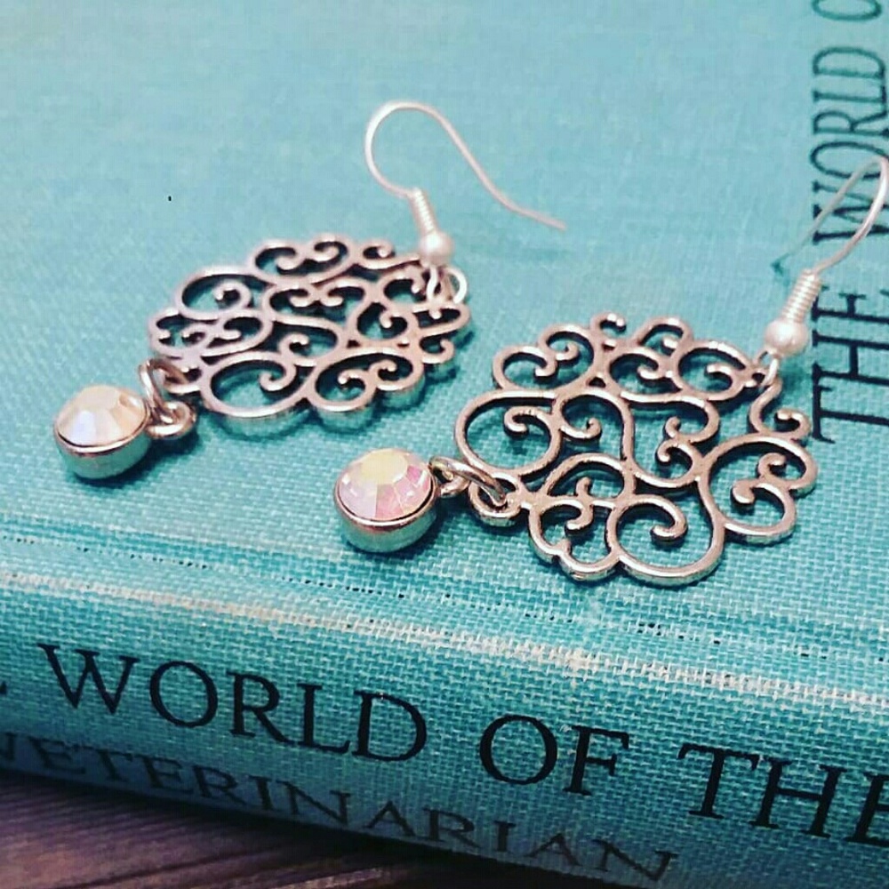 Open scroll whimsy silver earrings with crystal